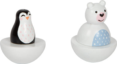 Die Spieluhr Arktis besteht aus zwei Schaukelspielzeugen aus Holz mit bemalten Details: links ein Pinguin und rechts ein Eisbär.