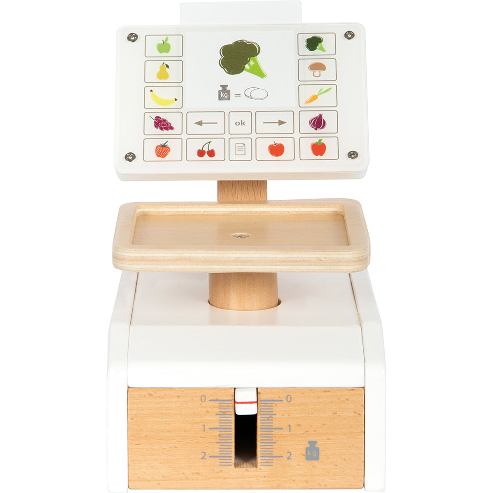 Die Waage „fresh“ ist eine Spielzeugkasse aus Holz mit einem Touchscreen, auf dem Obst- und Gemüsesymbole angezeigt werden, und einer integrierten Waage unterhalb des Bildschirms.