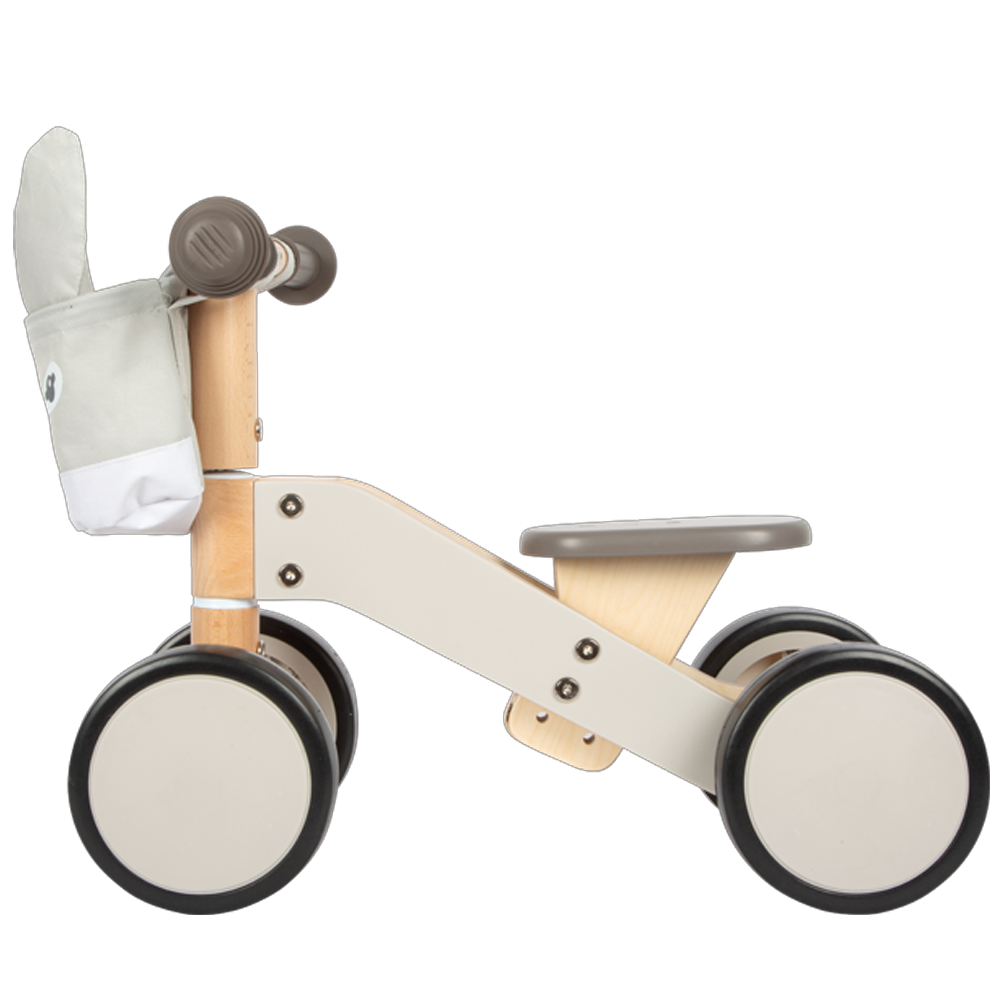 Das Rutschfahrzeug Esel ist ein kleines beige-graues Laufrad aus Holz für Kleinkinder mit vier Rädern und einem hasenförmigen Vorderkorb.