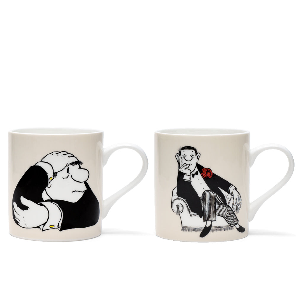 2er-Set Porzellanbecher mit Künstlermotiven: „Der Denker“ zeigt einen besorgten Mann, „Herr im Sessel“ einen entspannten Mann mit einer roten Blume auf dem Anzug.