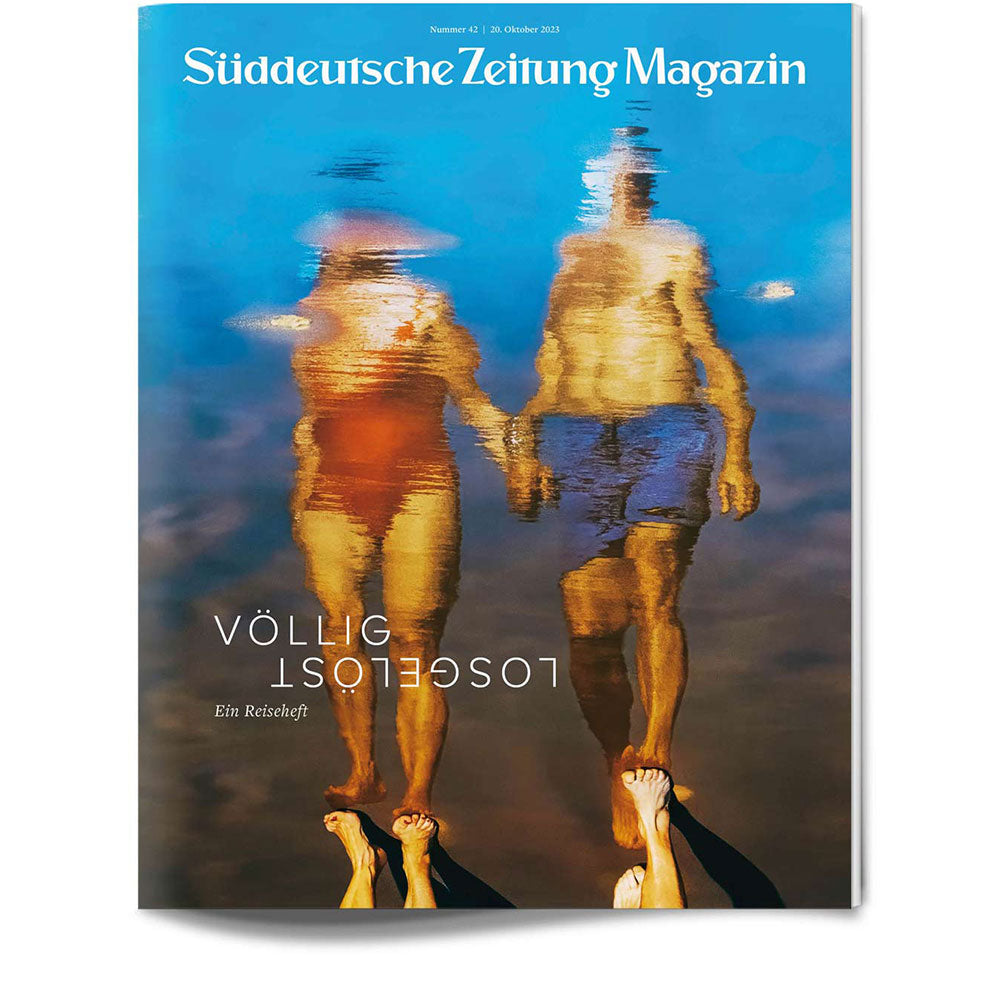 Unscharfe Spiegelung eines Mannes und einer Frau, die am Wasser stehen, auf dem Titelblatt des Süddeutsche Zeitung Magazins.