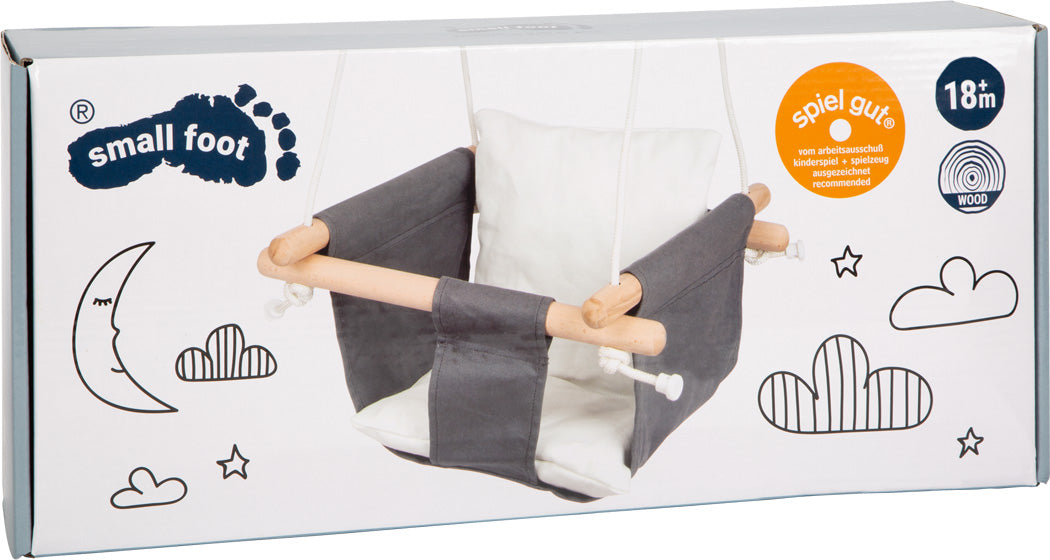Schachtel für die Babyschaukel Komfort, verziert mit Wolken- und Mondillustrationen und beschriftet für Kinder ab 18 Monaten.