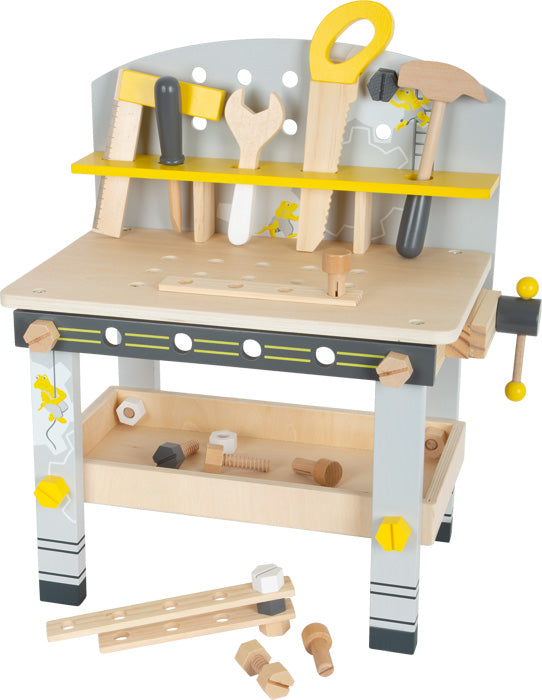 Die Werkbank kompakt „Miniwob“ ist eine Spielzeug-Werkbank aus Holz, die mit Werkzeugen wie Säge, Schraubenschlüssel, Hammer und verschiedenen Schrauben und Muttern ausgestattet ist.