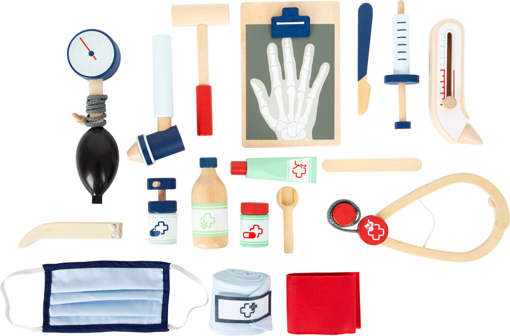 Arzttasche: Ein Spielzeug-Arztkoffer mit medizinischen Instrumenten, Flaschen, Salben, einer Maske, Bandagen und einem Handröntgengerät.