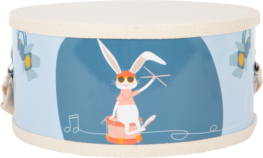 Auf einer runden Spielzeugtrommel namens „Groovy Beats“ liegt seitlich ein Cartoon-Kaninchen mit Sonnenbrille, das Schlagzeug spielt.