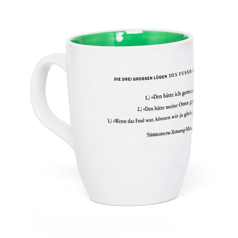 Weiße Tasse mit grüner Innenseite und seitlich aufgedrucktem deutschem Text.