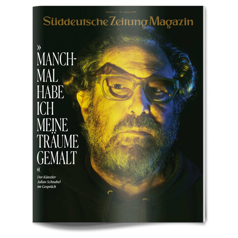 Titelbild des Süddeutsche Zeitung Magazins mit einem bärtigen Mann mit Brille in dramatischer gelber Beleuchtung.