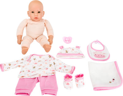 Puppe „Hanna“ wird mit einem rosa-weißen Outfit, einer Mütze, einem Lätzchen, einem Schnuller, einer Decke und Schuhen geliefert, die um die Puppe herum angeordnet sind.