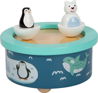 Die Spieluhr Arktis ist eine blaue Spieluhr mit Pinguin- und Eisbärfiguren, verziert mit bezaubernden Tierillustrationen.