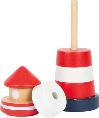 Das Stapelturm-Leuchtturm Großer Ozean-Stapelspielzeug aus Holz besteht aus roten, weißen und blauen Ringen, einige gestapelt und einige getrennt, die auf einem weißen Hintergrund dargestellt sind.