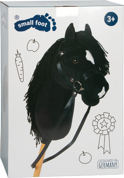 Spielzeug-Steckenpferd mit schwarzer Mähne auf der Verpackung, für 3+ Jahre