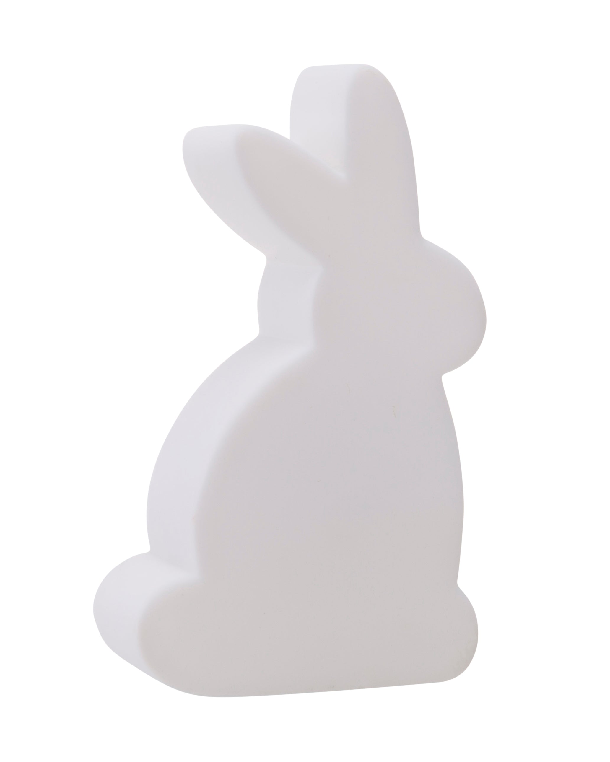 Eine weiße, minimalistische Kaninchenfigur, die seitlich auf einem schlichten Hintergrund blickt.
