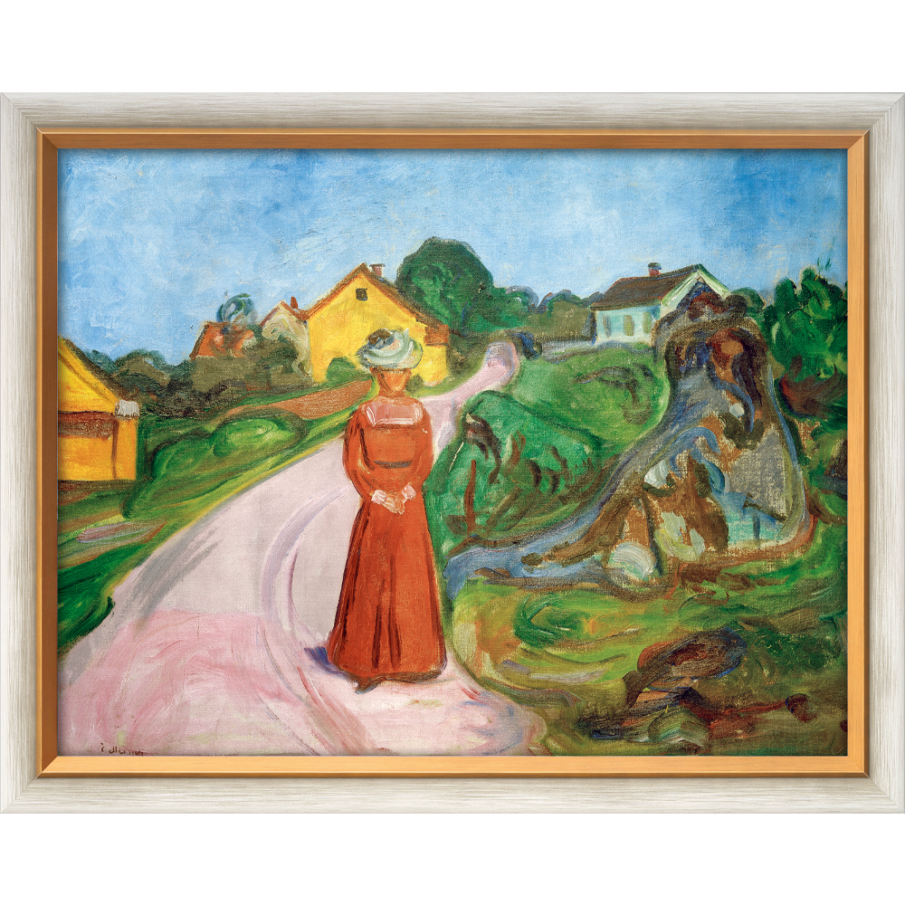 Das gerahmte Bild „Frau im roten Kleid (Straße in Asgardstrand)“ (1902/03) von Edvard Munch zeigt eine Frau in einem roten Kleid auf einem rosa Weg, umgeben von bunten Häusern und Grün unter einem blauen Himmel.