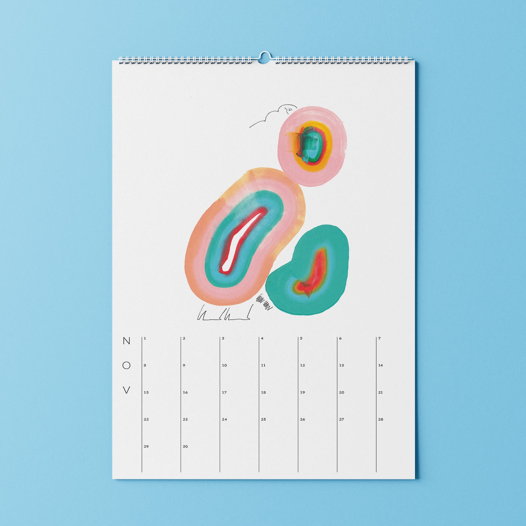 Minimalistisches Kalenderblatt für November mit bunten abstrakten Formen auf weißem Hintergrund, hängend an einer blauen Wand.
