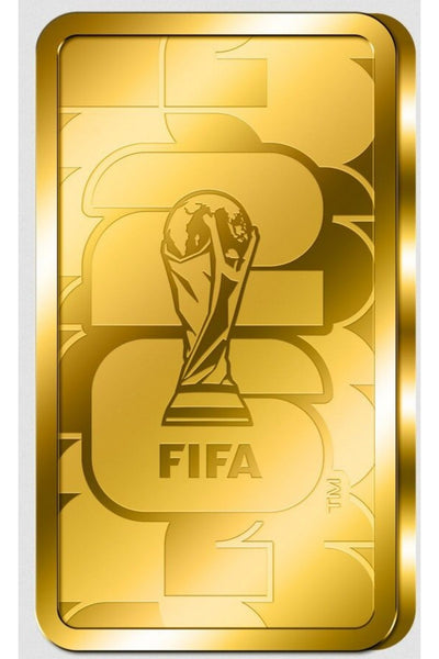 Ein goldener, rechteckiger Barren mit der Trophäe der FIFA-Weltmeisterschaft und dem Wort FIFA unter dem Bild der Trophäe.