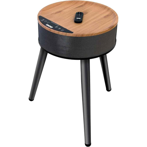 Runder Holztisch mit schwarzen Beinen, eingebautem Heizlüfter und einer kleinen Fernbedienung auf der Oberseite.