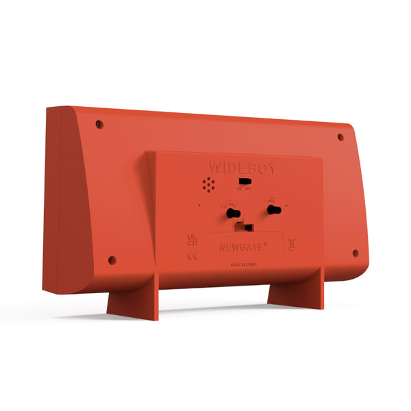 Rückansicht einer roten rechteckigen Uhr mit sichtbaren Schaltern und Batteriefach.