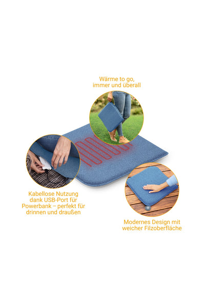 Ein blaues Heizkissen mit Filzoberfläche und USB-Anschluss für die Nutzung einer Powerbank, das in der Hand gehalten und auf einem Stuhl verwendet wird und sein kabelloses und tragbares Design unterstreicht.