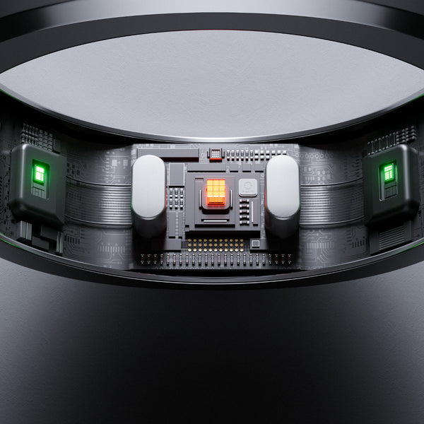 Nahaufnahme eines eleganten elektronischen Schaltkreises mit einem orangefarbenen Licht in der Mitte und zwei grünen Lichtern auf beiden Seiten.