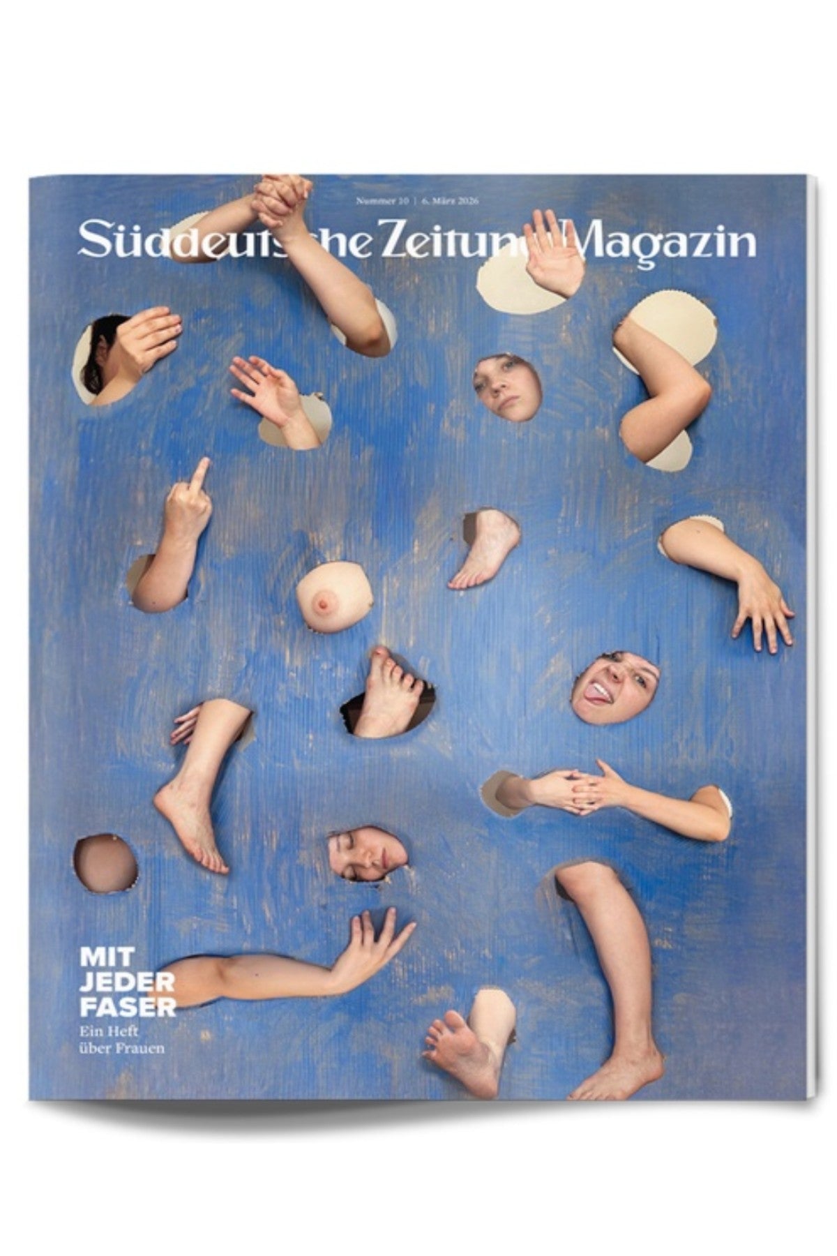 Titelblatt des Süddeutsche Zeitung Magazins mit verschiedenen Körperteilen - Arme, Beine, Hände, Gesichter -, die durch Löcher in einer blauen Holzoberfläche ragen.