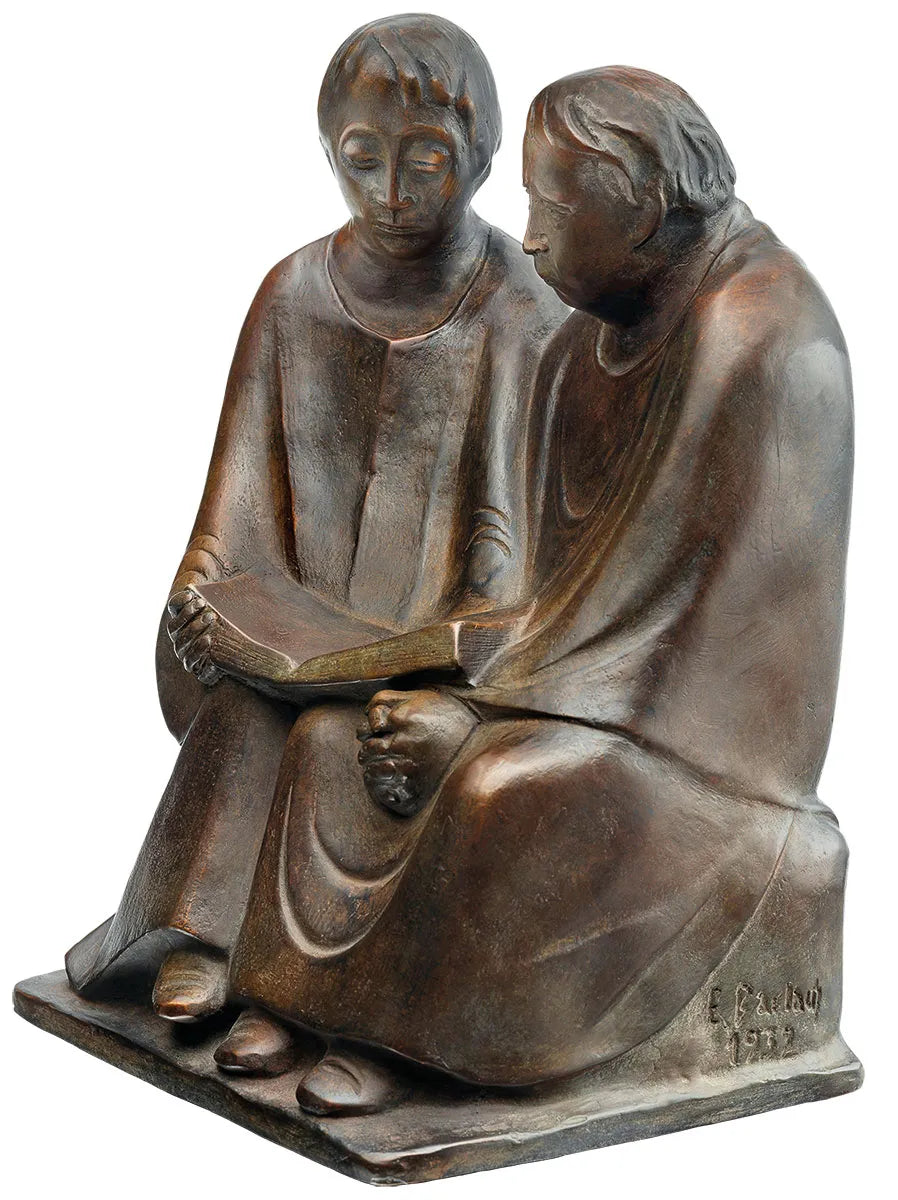 Bronzeskulptur von zwei sitzenden Figuren, die gemeinsam ein Buch lesen, geschaffen von E. Barlach im Jahr 1923.