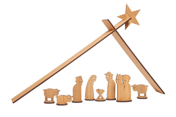 Minimalistische Holzkrippe mit Figuren unter einem einfachen Dach und einem Stern.