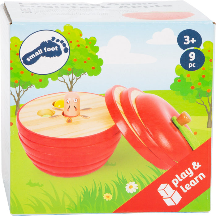 Lernspiel Logisteck Apfel: 9-teilige Spielzeug-Apfelbox mit Wurm, Aufschrift „Play & Learn“, ab 3 Jahren, Verpackung mit Outdoor-Hintergrund.