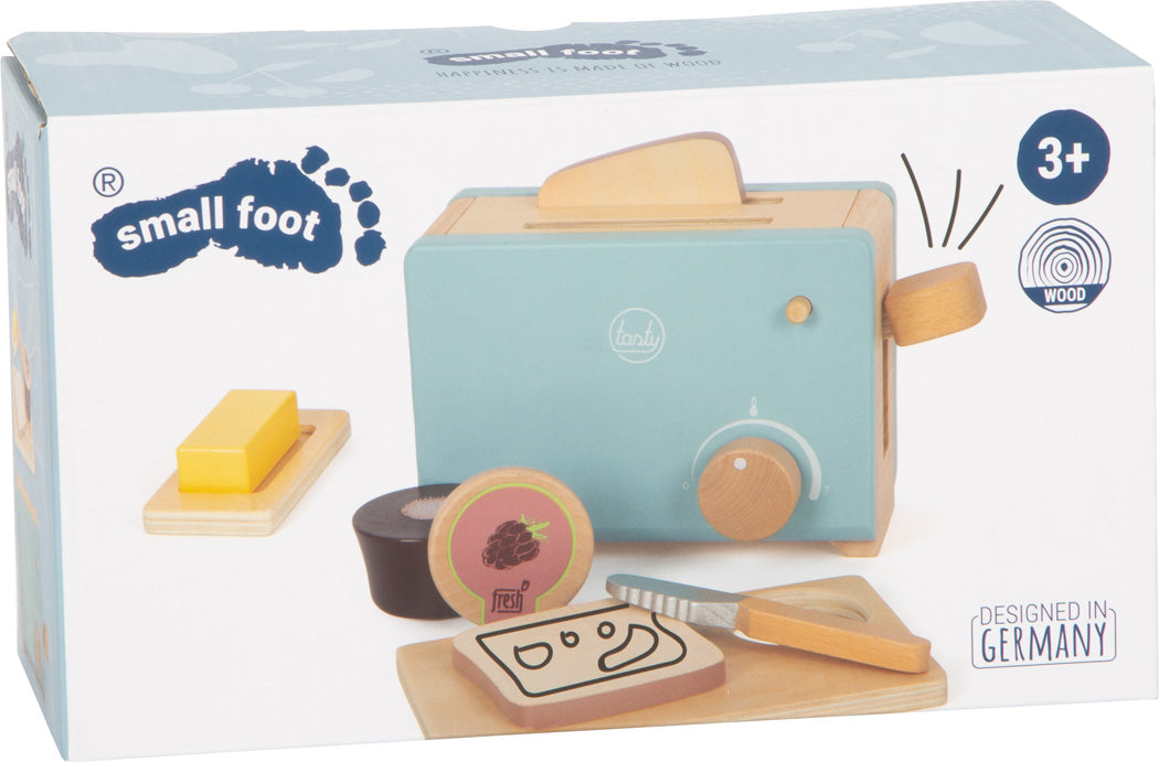 Das Toaster-Set „Lecker“ ist ein Holzspielzeug-Toaster-Set mit Brot, Butter, Messer und Marmelade, geeignet für Kinder ab 3 Jahren, von Small Foot.