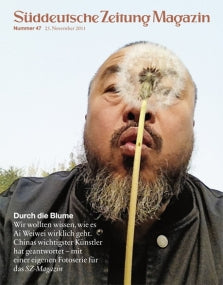 Bärtiger Mann, der einen Löwenzahn auspustet, auf dem Titelbild des Süddeutsche Zeitung Magazins.