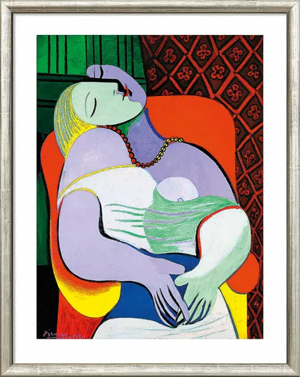 Gerahmter Kunstdruck von Pablo Picassos „Le Rêve – Der Traum“ (1932): zeigt eine Frau mit geschlossenen Augen, die inmitten abstrakter Formen und leuchtender Farben auf einem Stuhl liegt.