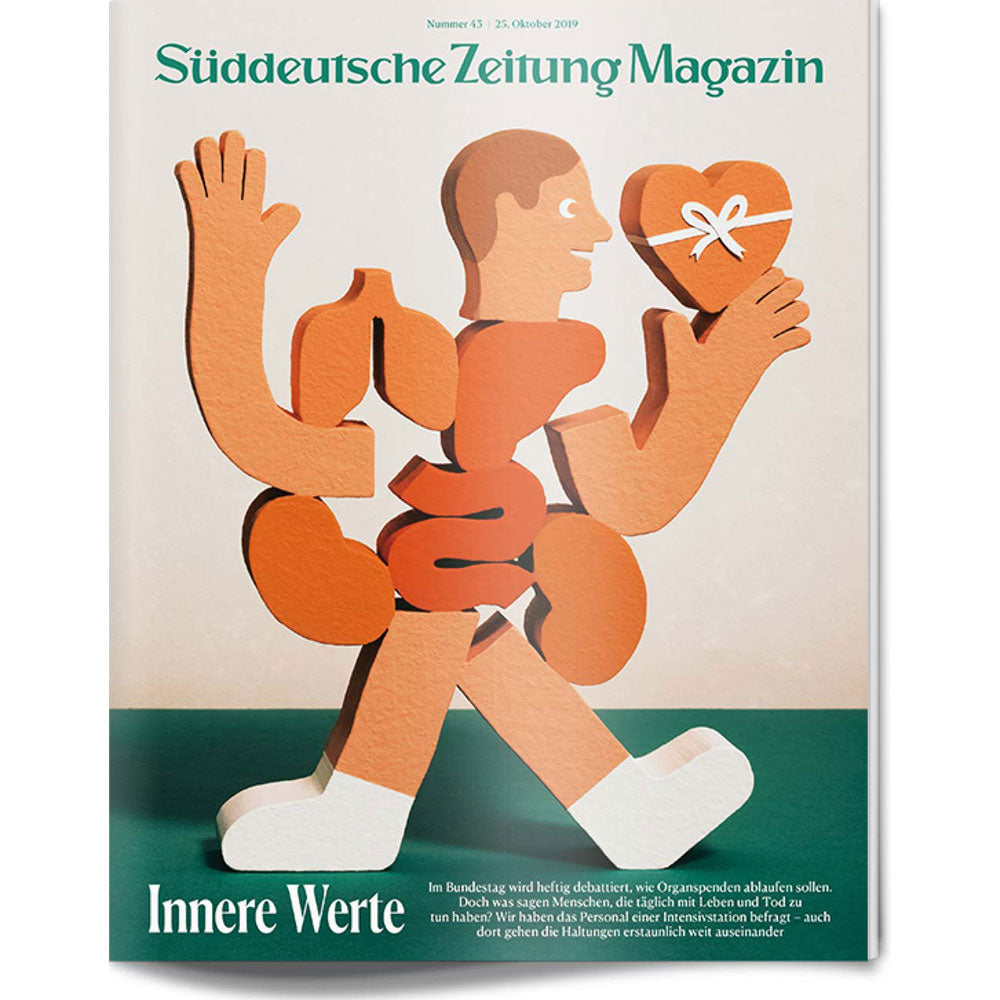 Eine stilisierte Figur mit freiliegenden Organen hält ein herzförmiges Geschenk auf dem Cover des Süddeutsche Zeitung Magazins.