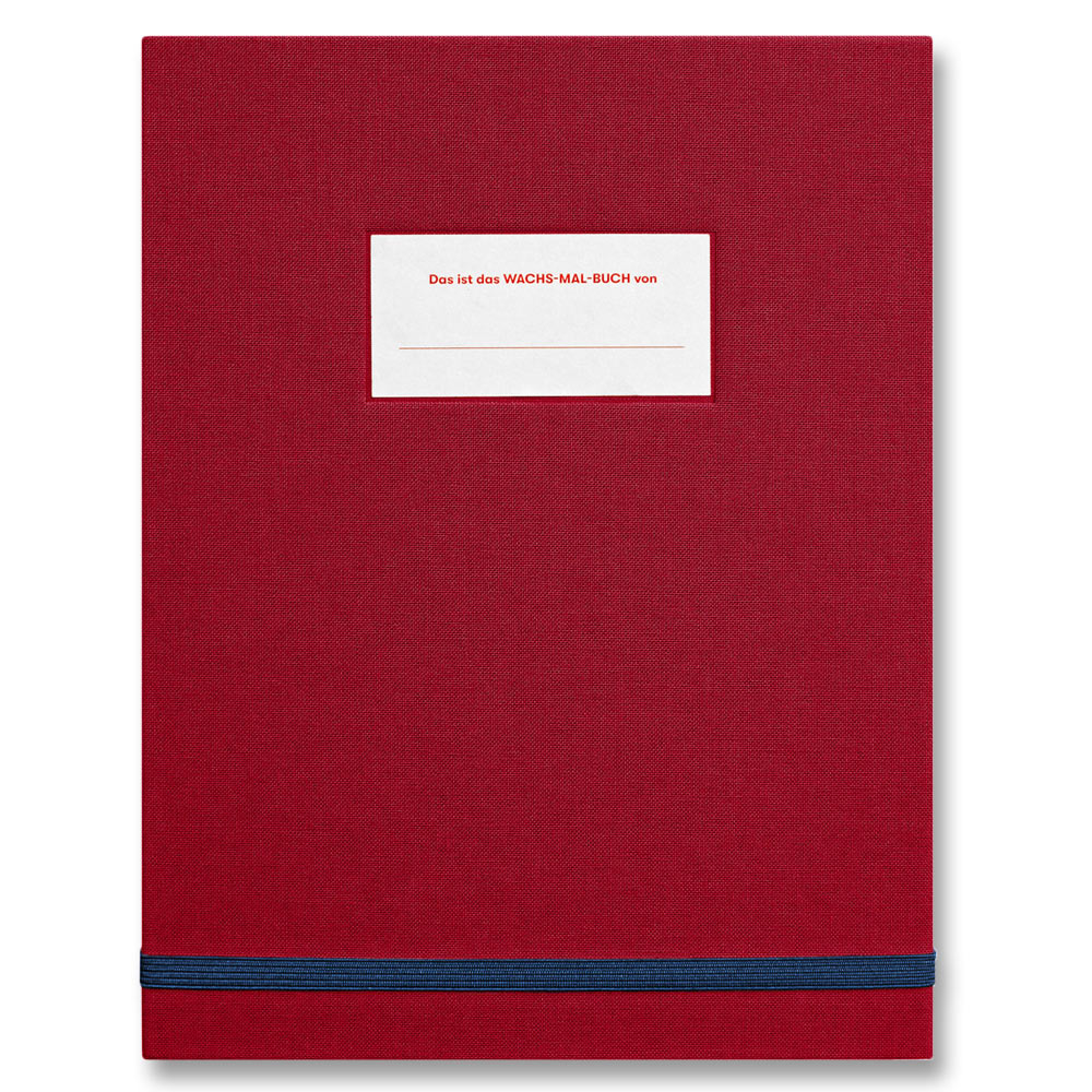 Ein rotes Notizbuch mit weißem Etikett und blauem Gummiband, beschriftet mit der deutschen Aufschrift „Das ist das WACHS-MAL-BUCH von“.