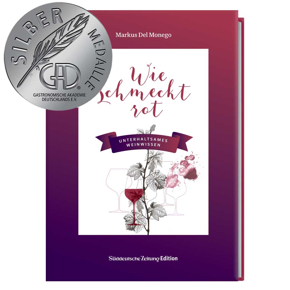 Rotes Buch „Wie schmeckt rot“ mit Weingläsern auf dem Cover und einer Silbermedaille in der oberen linken Ecke.